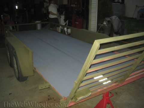 1987 Suzuki Samurai - A utility trailer is shown in a garage setting, with a person in the background.