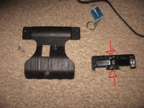 1990 Ford Bronco - Two parts of a car roof rack system are shown laid out on a carpeted surface.