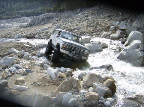 1986 Ford Bronco - This 1980 Ford Bronco navigates a challenging rocky stream bed.