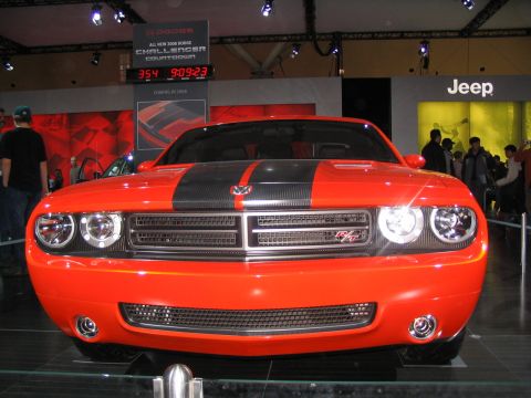 1993 Ford Taurus - This 2008 Dodge Challenger was displayed at an auto show, a prominent front grille and racing stripes.