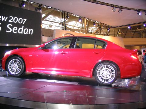 1993 Ford Taurus - A red sedan is displayed on a platform at the Toronto International Auto Show in 2007.