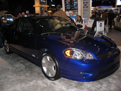 1993 Ford Taurus - A blue Chevrolet Monte Carlo SS coupe is displayed at an auto show.