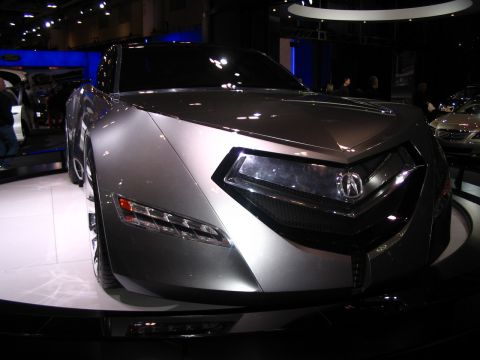 1993 Ford Taurus - Acura concept car with aggressive styling and unique front fascia at an auto show.
