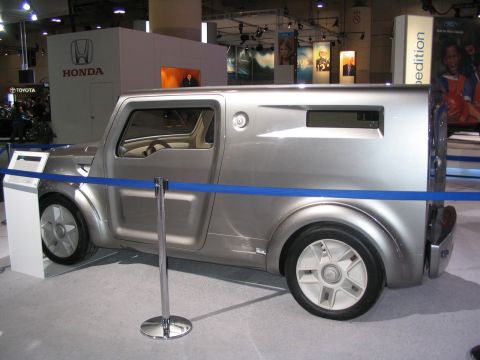 1993 Ford Taurus - A unique concept van with a futuristic design is showcased at an auto exhibition.