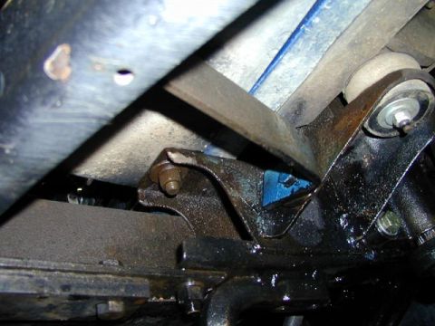 1979 Ford Bronco - This image shows a close-up view of a vehicle's suspension system, focusing on a specific part with visible blue paint.