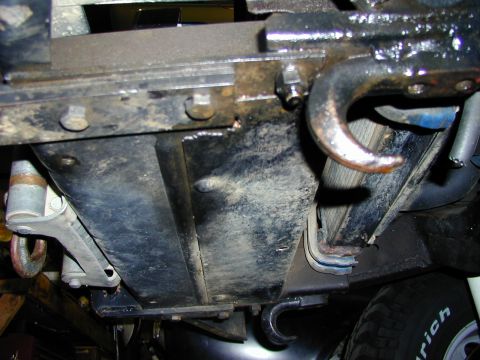 1979 Ford Bronco - Close-up of vehicle undercarriage with tow hooks and frame details, Supermotors.net logo present.