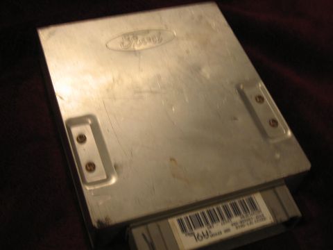 1994 Ford Bronco - Ford engine control module with visible part number and connector.
