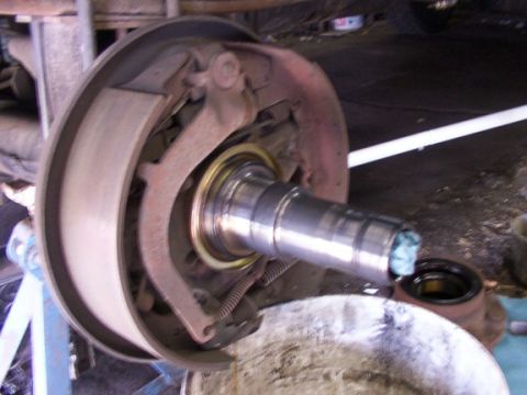 1995 Ford C-350 (Centurion Conversions) - Close-up view of a vehicle's drum brake assembly, highlighting the internal components and a greased spindle.