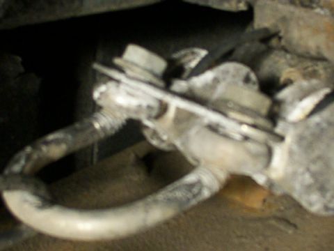 1995 Ford C-350 (Centurion Conversions) - Detail of a vehicle's brake system, likely a caliper and brake line, showing mechanical components.