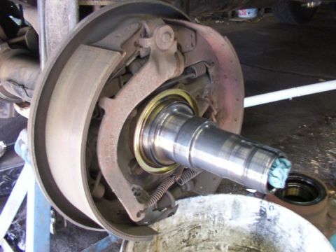 1995 Ford C-350 (Centurion Conversions) - Close-up view of a vehicle's drum brake assembly, highlighting the internal components and a spindle.