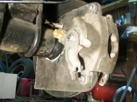 1995 Ford C-350 (Centurion Conversions) - Disc brake caliper and rotor assembly shown in detail, likely from a truck or large SUV.