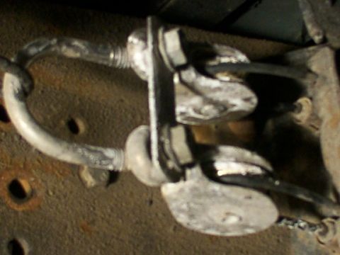 1995 Ford C-350 (Centurion Conversions) - Close-up view of a vehicle's brake caliper and rotor assembly, highlighting mechanical components and brake lines.