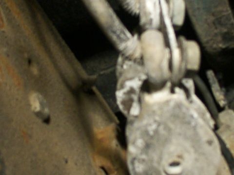 1995 Ford C-350 (Centurion Conversions) - Undercarriage component with visible corrosion and mechanical attachments.