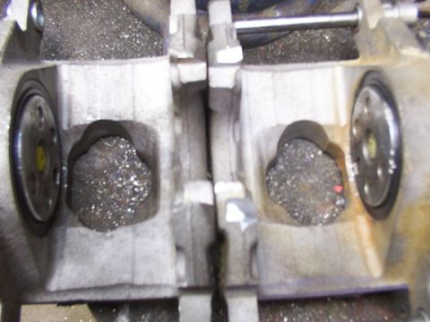1995 Ford C-350 (Centurion Conversions) - This image shows a close-up view of a brake caliper, likely from a truck, filled with debris.
