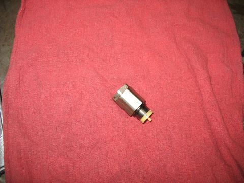 1995 Ford C-350 (Centurion Conversions) - A single brake pressure differential valve is shown resting on a red cloth.