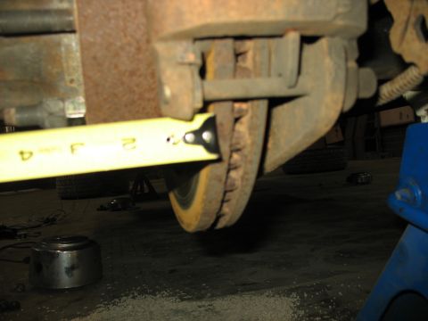 1995 Ford C-350 (Centurion Conversions) - A tape measure is used to measure the Sterling disc brakes on a vehicle.