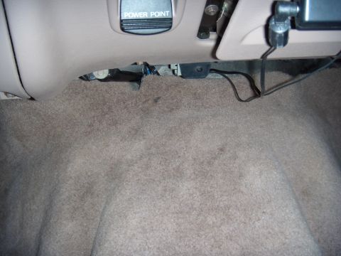 1992 Ford Bronco - Car interior floor with a visible "Power Point" outlet.