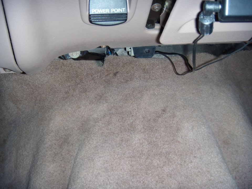 Interior car floor showing carpet and a "Power Point" outlet