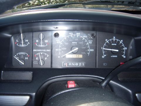 1992 Ford Bronco - Interior view of a 1992 Ford Bronco dashboard, showing the speedometer, tachometer, and other essential gauges.