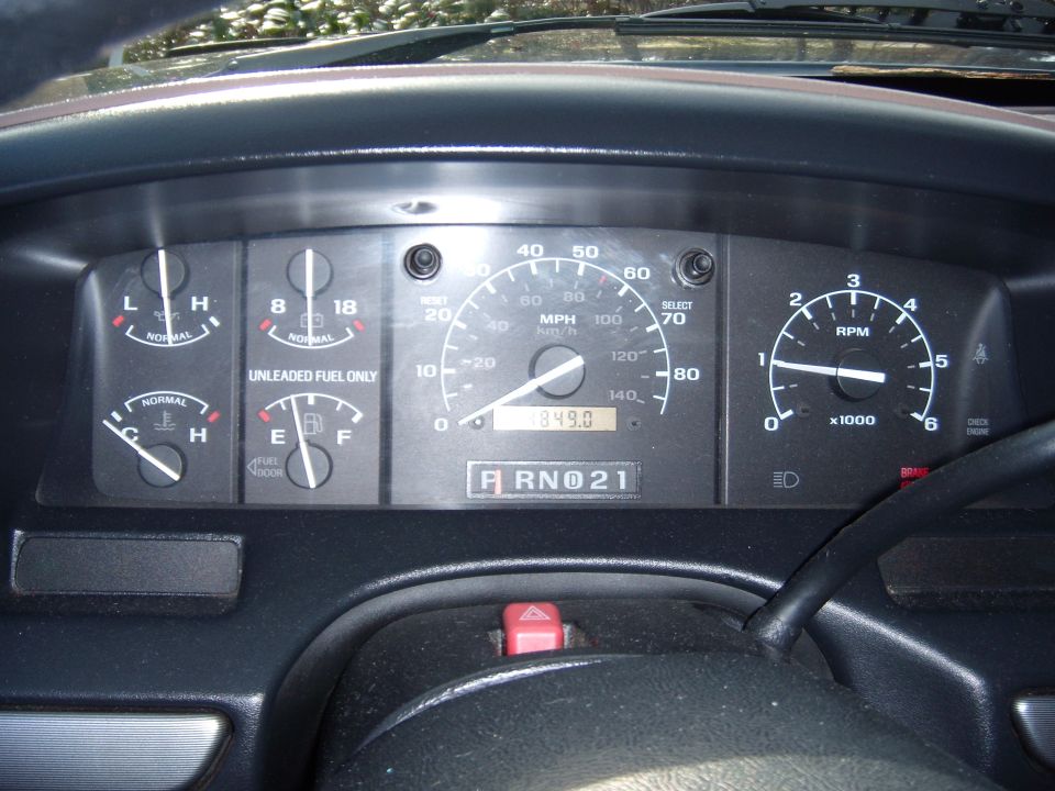 1992 Ford Bronco dashboard with speedometer, tachometer, fuel, and temperature gauges