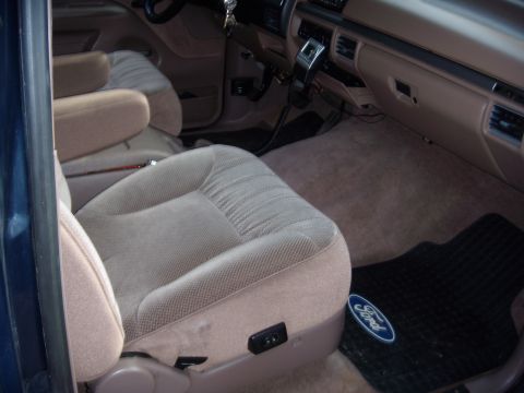 1992 Ford Bronco - Interior view of a 1992 Ford Bronco, highlighting the tan upholstery and dashboard details.