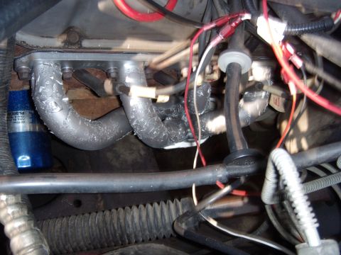 1992 Ford Bronco - Close-up view of an engine manifold with associated wiring and plumbing.