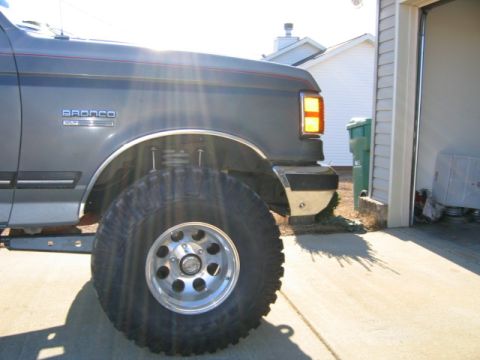 1989 Ford Bronco - The side emblem reads 'BRONCO' and 'XLT', indicating this is a Ford Bronco, likely from the late 1980s.