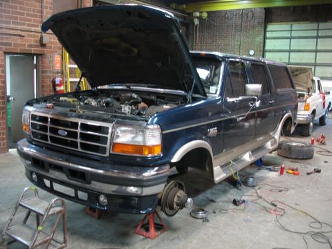 1995 Ford C-350 (Centurion Conversions) - This 1995 Ford C-350 (Centurion Conversions) is undergoing service with its front wheels removed.