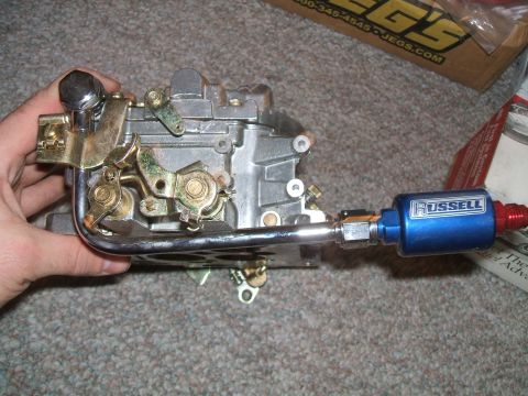 1974 Dodge Challenger - A close-up view of a Holley carburetor and a Russell fuel filter, likely for sale or repair.