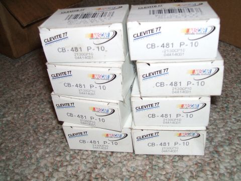 1974 Dodge Challenger - Several boxes of Clevite 77 engine bearings are stacked on a carpeted surface.