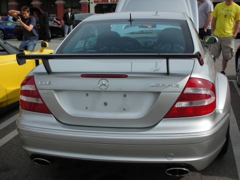 1998 Ford Crown Victoria - Rear view of a silver Mercedes-Benz CLK AMG coupe fitted with a large rear wing at a busy car meet.
