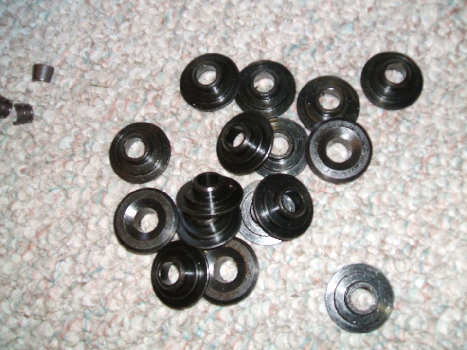 Valve keepers and retainers scattered on carpet