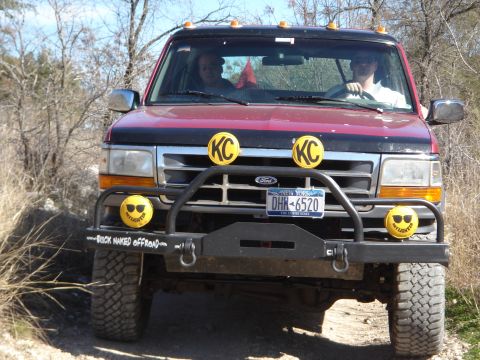 1995 Ford Bronco - This 1995 Ford Bronco features KC lights and a custom brush guard, seen here on an off-road trail.