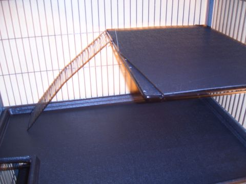 1993 Ford Bronco - Two dark platforms and a ramp are shown inside a wire cage.