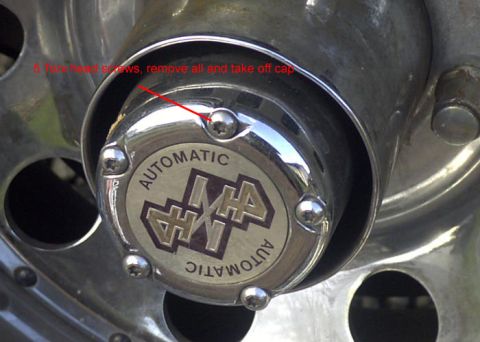 1991 Ford Bronco - Close-up of a Warn automatic locking hub, with instructions for removal.