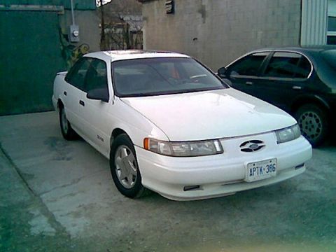1993 Ford Taurus - This 1993 Ford Taurus sedan is seen from the front 3/4 view. The license plate is visible.