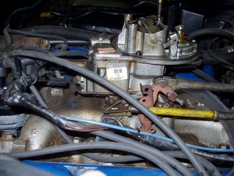 1972 Ford Ranchero - Carburetor assembly with associated engine wiring and fuel lines visible.