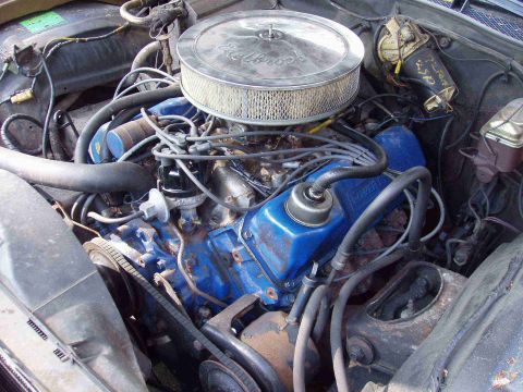 1972 Ford Ranchero - Close-up view of a vehicle's engine compartment, showing various components and wiring.