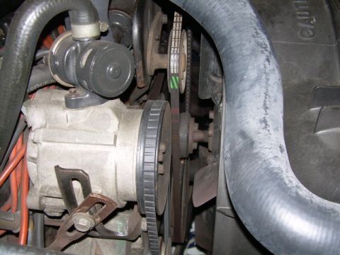1984 Ford Bronco - Engine bay detail with alternator and drive belts visible.