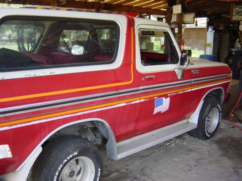 1978 Ford Bronco - This 1978 Ford Bronco has a two-tone red and white paint scheme with decorative stripes.