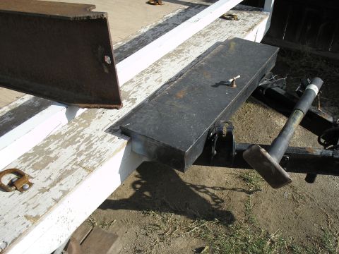 1990 Ford Bronco - A black metal toolbox is mounted on the tongue of a trailer.