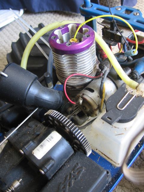 1974 Ford F-100 - Close-up of a radio-controlled car's internal combustion engine and associated parts.