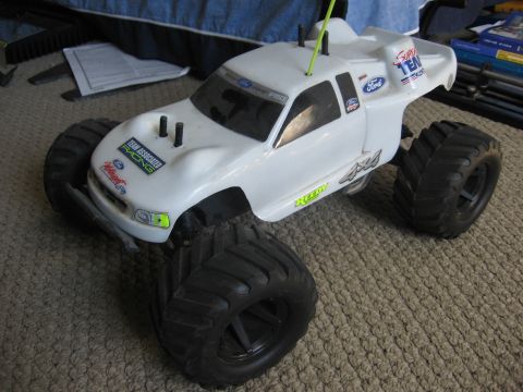 1974 Ford F-100 - This white remote control monster truck features "Team Associated Racing" and "Ford" branding, with "4x4" graphics on the side.