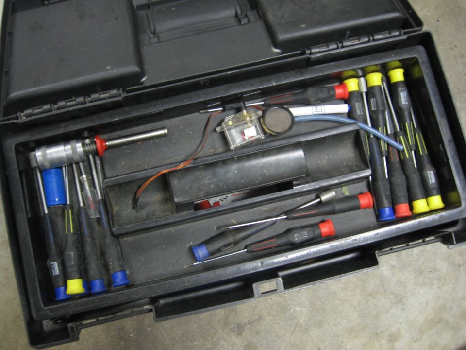 Toolbox with assorted screwdrivers and small tools
