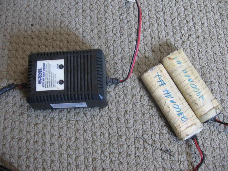 Tower Power AC/DC quick charger with two batteries labeled "#1 3400mAh" and "#2 3400mAh"