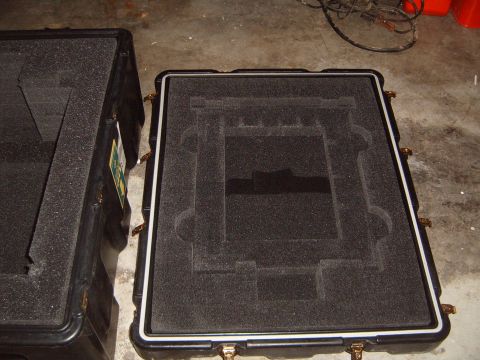 1988 Ford Bronco - Two protective cases with custom foam interiors are shown, likely for transporting sensitive equipment.