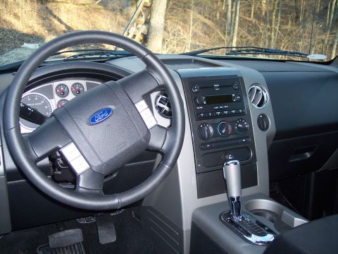 2007 Dodge Durango - Interior view of a Ford F-150, showing the steering wheel, dashboard, and center console.