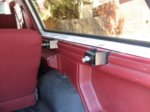 1986 Ford Bronco - Close-up of interior trim and mounting hardware, with a SuperMotors watermark visible.