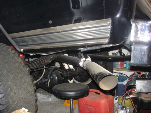 1979 Ford F-250 - Undercarriage view showing the exhaust system and rear axle components of a vehicle.