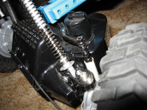 1984 Ford Bronco - Detail of a remote control car's suspension system, showing springs and mechanical linkages.